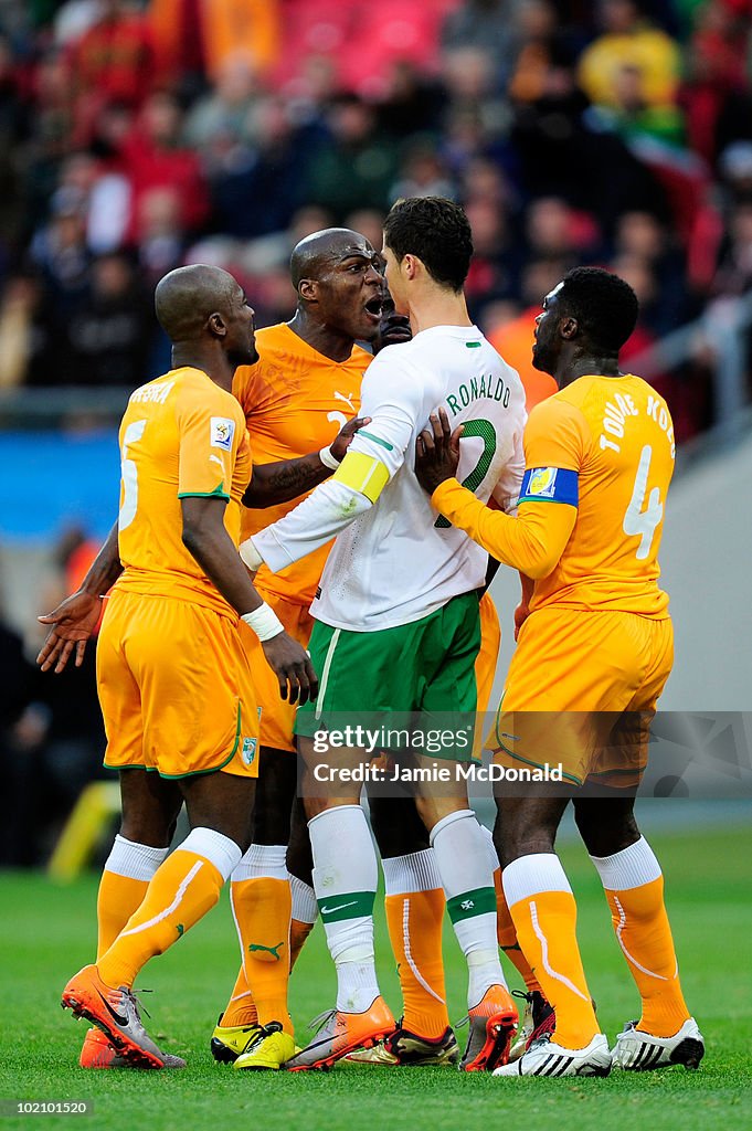 Guy Demel of Ivory Coast argues with Cristiano Ronaldo during the News  Photo - Getty Images