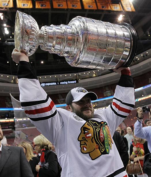 john-madden-of-the-chicago-blackhawks-hoists-the-stanley-cup-after-the-blackhawks-defeated-the.jpg