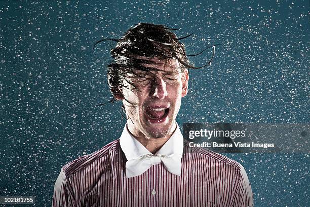 young man in rain - wet hair stock pictures, royalty-free photos & images