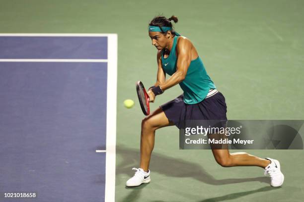 Caroline Garcia of France returns a shot to Aliaksandra Sasnovich of Belarus during Day 2 of the Connecticut Open at Connecticut Tennis Center at...