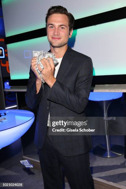 Samuel Schneider with "Buck dollars" during the ''Asphaltgorillas' premiere after party at 'traffic club' on August 21, 2018 in Berlin, Germany.