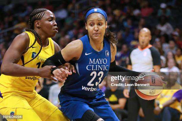 Maya Moore of the Minnesota Lynx handles the ball against Chelsea Gray of the Los Angeles Sparks in Round One of the 2018 WNBA Playoffs at Staples...