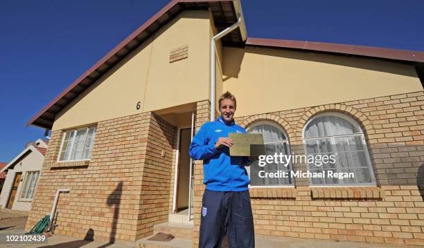 Michael Dawson stands outside a home in the SOS Children's Village project on June 15, 2010 in Rustenburg, South Africa.