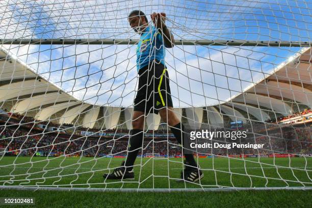 Referee Jorge Larrionda checks the nets ahead of the 2010 FIFA World Cup South Africa Group G match between Ivory Coast and Portugal at Nelson...
