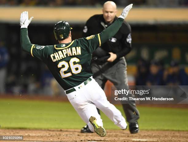 Matt Chapman of the Oakland Athletics scores against the Texas Rangers in the bottom of the fifth inning at Oakland Alameda Coliseum on August 21,...