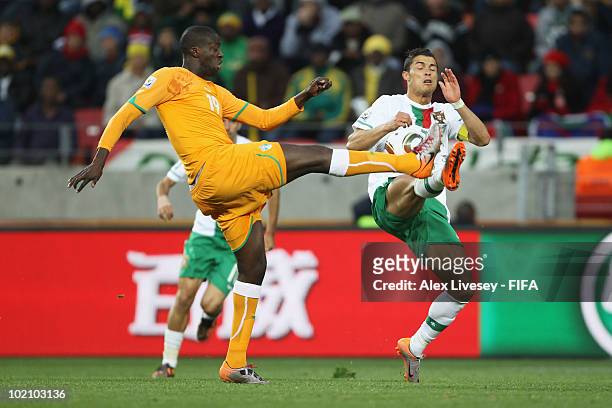 Cristiano Ronaldo of Portugal and Yaya Toure of Ivory Coast battle for the ball during the 2010 FIFA World Cup South Africa Group G match between...