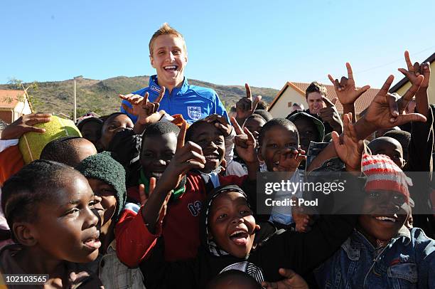 Englands Michael Dawson visits Children from the SOS Children's Village project on June 15, 2010 in Tlhabane Township near Rustenburg, South Africa.