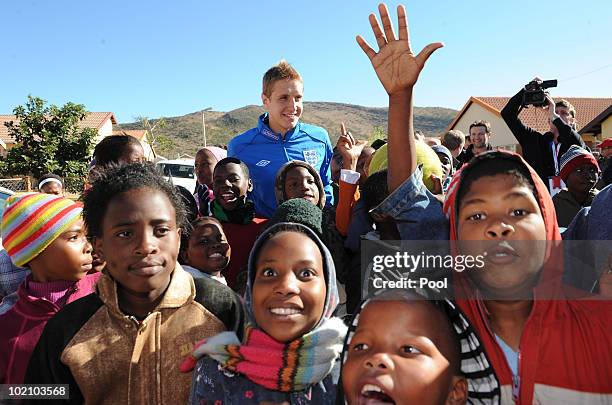 Englands Michael Dawson visits Children from the SOS Children's Village project on June 15, 2010 in Tlhabane Township near Rustenburg, South Africa.