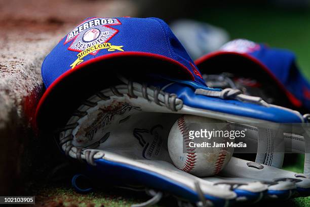 Detail of baseball gloves and hat of Acereros de Monclova during the match against Diablos Rojos at the end of 2010 Liga Mexicana de Beisebol serie...