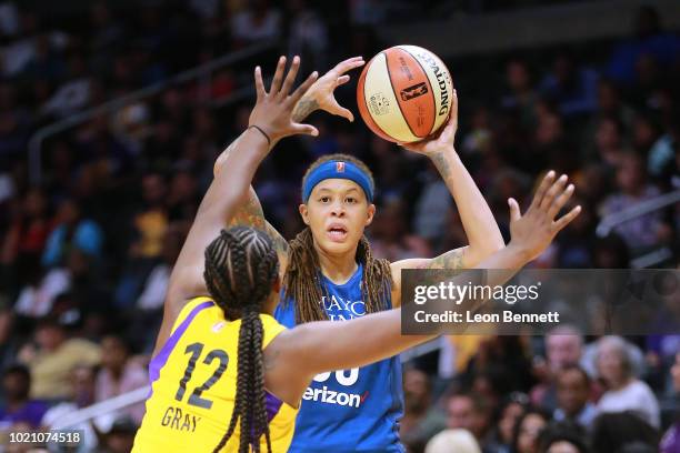 Seimone Augustus of the Minnesota Lynx handles the ball against Chelsea Gray of the Los Angeles Sparks in Round One of the 2018 WNBA Playoffs at...