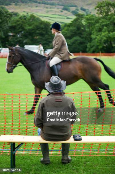 Man watches one of the riding events during Rosedale Show on August 18, 2018 in Kirkbymoorside, England. Founded in 1871, this annual show is held in...