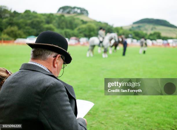 Judge reads his programme during Rosedale Show on August 18, 2018 in Kirkbymoorside, England. Founded in 1871, this annual show is held in Milburn...