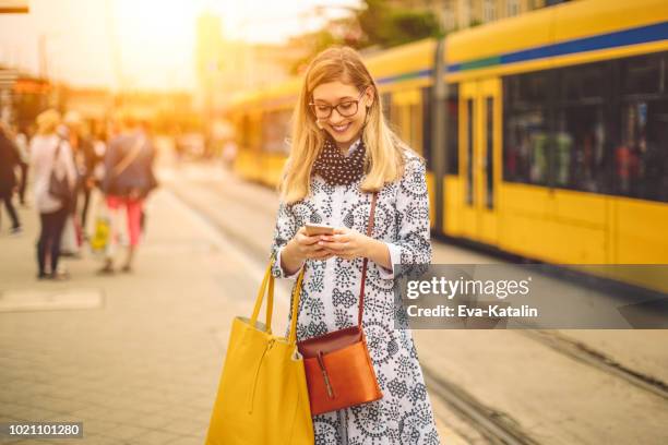 young woman is checking her messages - budapest metro stock pictures, royalty-free photos & images