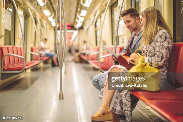 staying connected while on the subway - budapest metro stock pictures, royalty-free photos & images