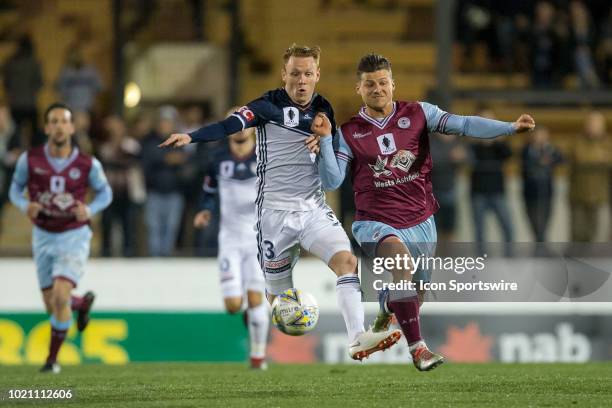 Melbourne Victory defender Corey Brown and APIA Leichhardt Tigers midfielder Corey Bizco battle for the ball at the FFA Cup Round 16 soccer match...