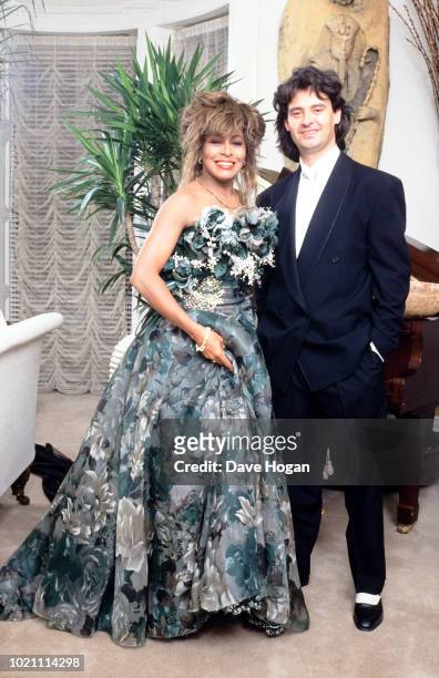 Singer Tina Turner poses with Erwin Bach to celebrate her 50th birthday in November 1989, London.