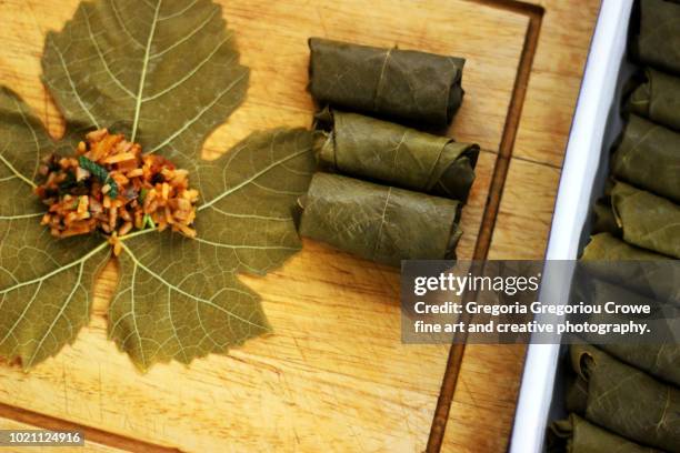 dolmathakia - stuffed grape leaves with rice and herbs - ドルマデス ストックフォトと画像