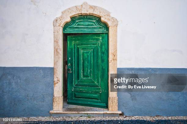open old door in faro town - open house stock-fotos und bilder