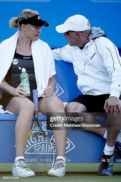 Elena Baltacha of Great Britain confers with her coach Nino Severino while playing Na Li of China during the AEGON International at Devonshire Park...