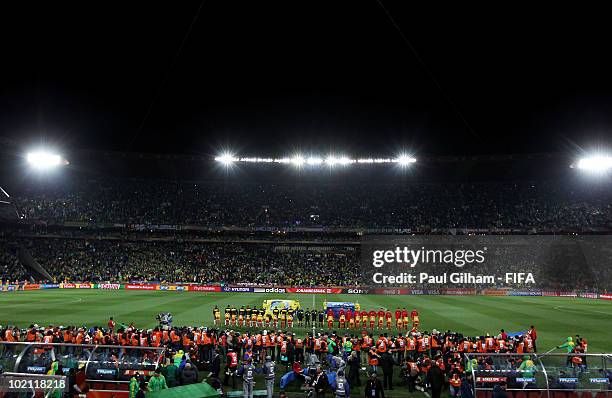 Brazil and North Korea players line up for their national anthems prior to the 2010 FIFA World Cup South Africa Group G match between Brazil and...