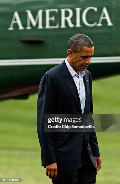 President Barack Obama walks across the White House South Lawn after arriving from an overnight trip to the Gulf Coast June 15, 2010 in Washington,...