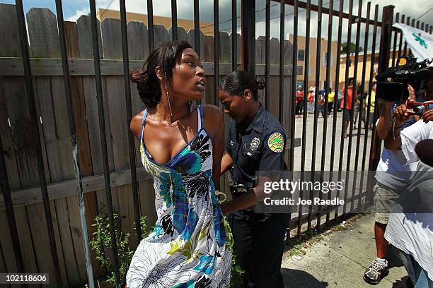 Ashaundre Young is arrested after becoming vocal and disruptive during a protest againt the evictions being carried out at the apartment complex in...