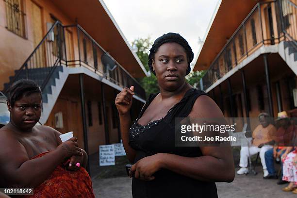 Brandy Young stands near her apartment before officials arrived to empty her apartment and change the locks during an eviction on June 15, 2010 in...