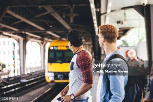 waiting on the platform for the train - rail transportation stock pictures, royalty-free photos & images