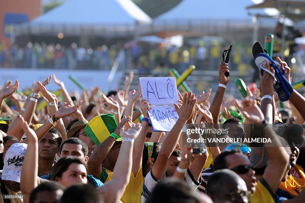 Brazilian fans celebrate their goal agai