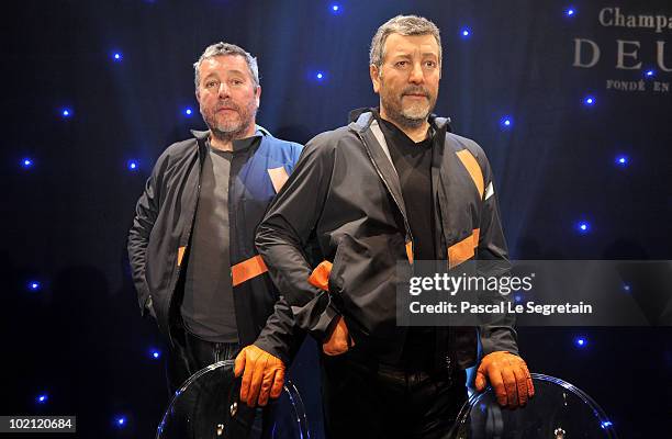 Philippe Starck poses next to his wax figure at Musee Grevin on June 15, 2010 in Paris, France.