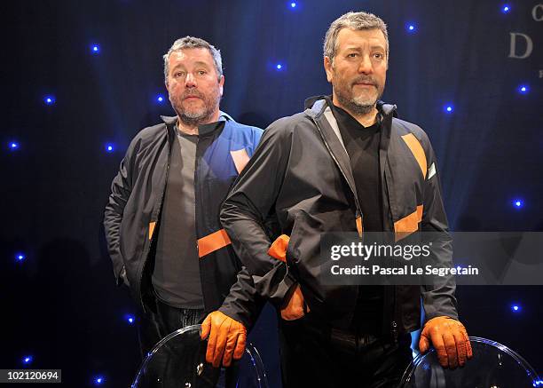 Philippe Starck poses next to his wax figure at Musee Grevin on June 15, 2010 in Paris, France.