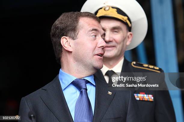 Russian President Dmitry Medvedev and Chief Commander of Russian Navy Vladimir Vysotsky chat during a ceremony to launch the multipurpose nuclear...