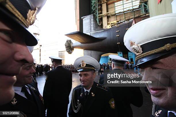 Military personnel attend a ceremony to launch the multipurpose nuclear submarine 'Severodvinsk' at the Sevmash shipyard June 15, 2010 in the...