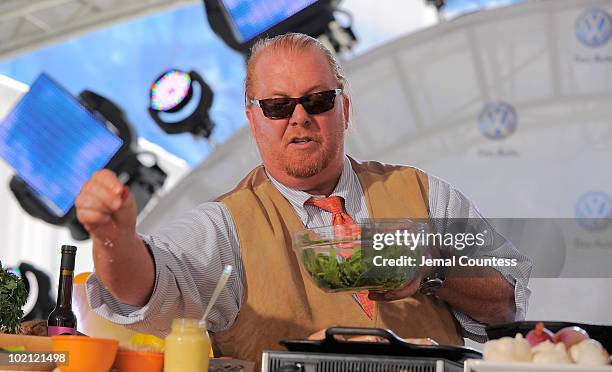 Chef Mario Batali prepares several dishes for the crowd at the world premiere of Volkswagen's new Jetta compact sedan at Times Square on June 15,...