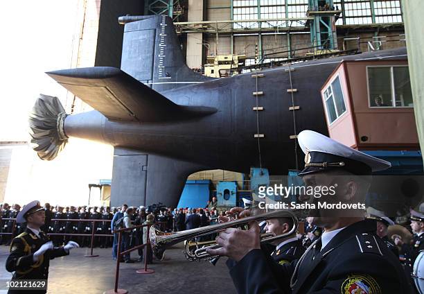Military orchestra plays during a ceremony to launch the multipurpose nuclear submarine 'Severodvinsk' at the Sevmash shipyard June 15, 2010 in the...