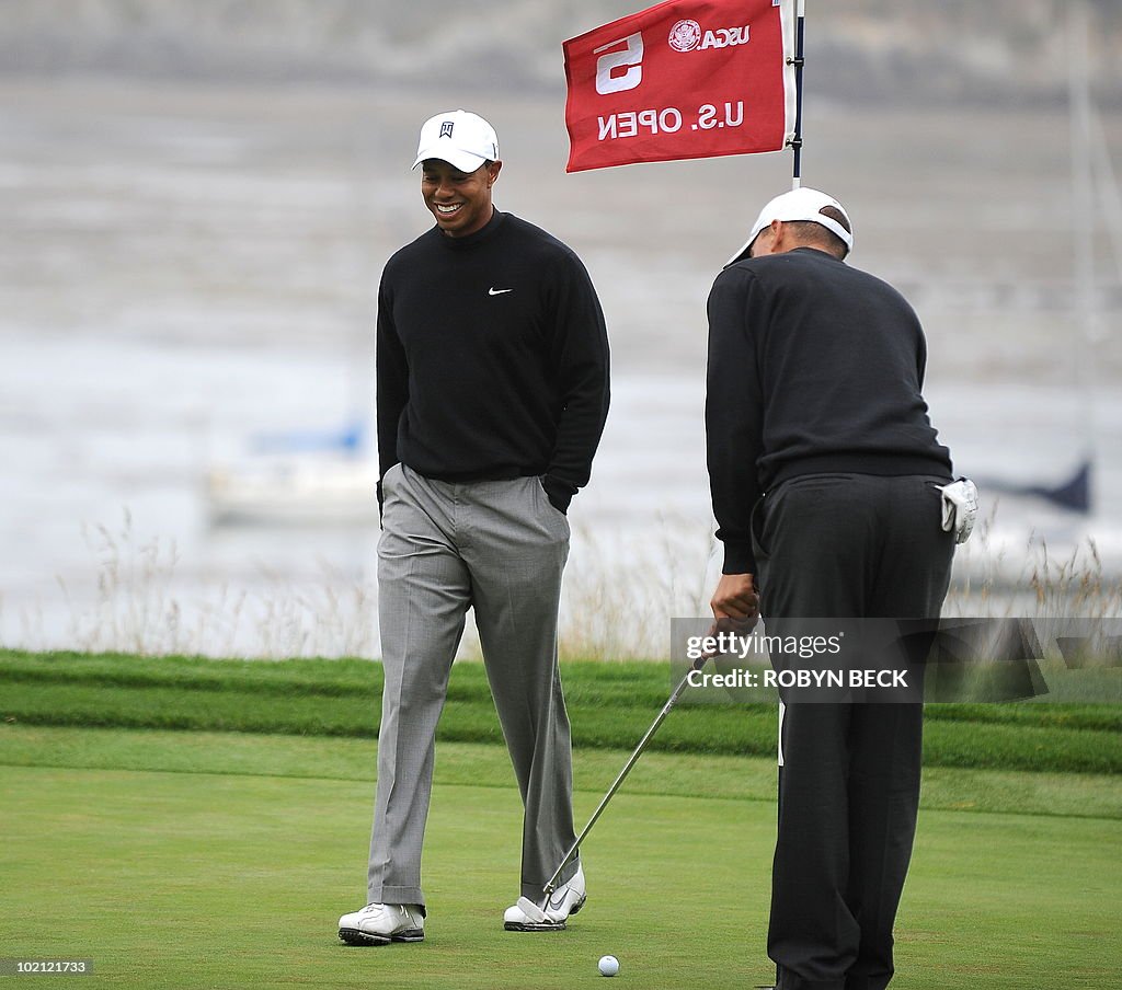 Americans Tiger Woods (L) and Joseph Bra