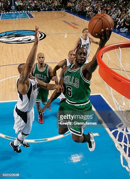 Ronald Murray of the Chicago Bulls takes the ball to the basket against Caron Butler of the Dallas Mavericks during the game at the American Airlines...