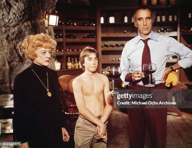 Actors Christopher Lee, Bette Davis and Ike Eisenmann in a scene from the movie 'Return From Witch Mountain' in 1977 in Los Angeles, California.