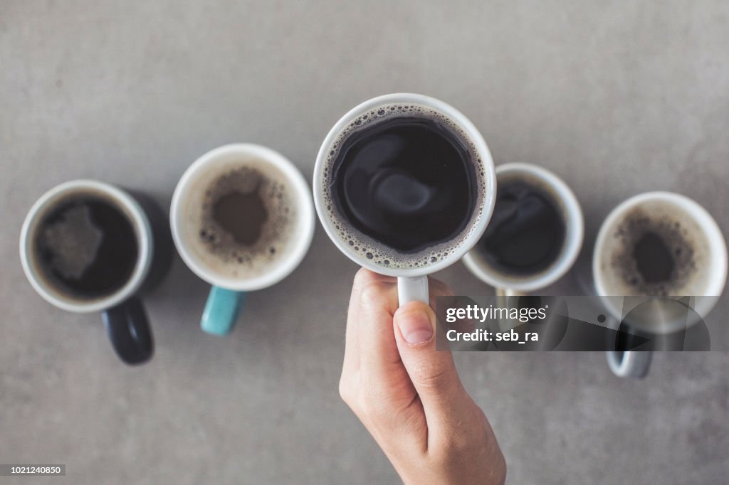 Female hand holding a cup of coffee