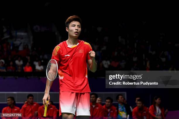 Shi Yuqi of China competes against Anthony Sinisuka Ginting of Indonesia during Men's Team final match between Indonesia and China on day four of the...