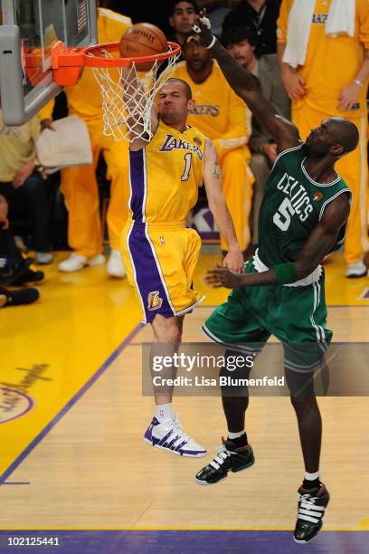 Jordan Farmar of the Los Angeles Lakers dunks the ball in front of Kevin Garnett of the Boston Celtics in Game Six of the 2010 NBA Finals at Staples...