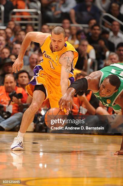 Jordan Farmar of the Los Angeles Lakers chases after a loose ball against Glen Davis of the Boston Celtics in Game Six of the 2010 NBA Finals on June...