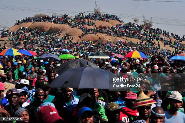 People gather during an event to commemorate the sixth anniversary of the Marikana massacre on August 16, 2018 in Rustenburg, South Africa. On August...