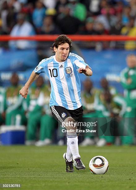 Lionel Messi of Argentina runs with the ball during the 2010 FIFA World Cup South Africa Group B match between Argentina and Nigeria at Ellis Park...