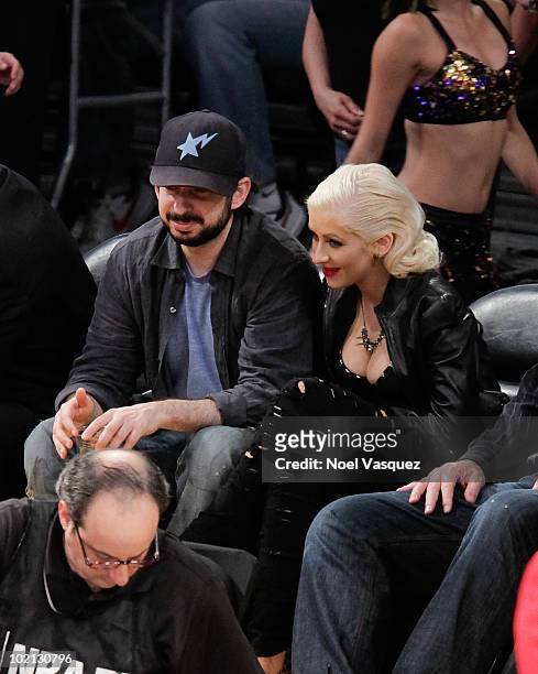 Christina Aguilera and her husband Jordan Bratman attend Game Six of the NBA playoff finals between the Boston Celtics and the Los Angeles Lakers...