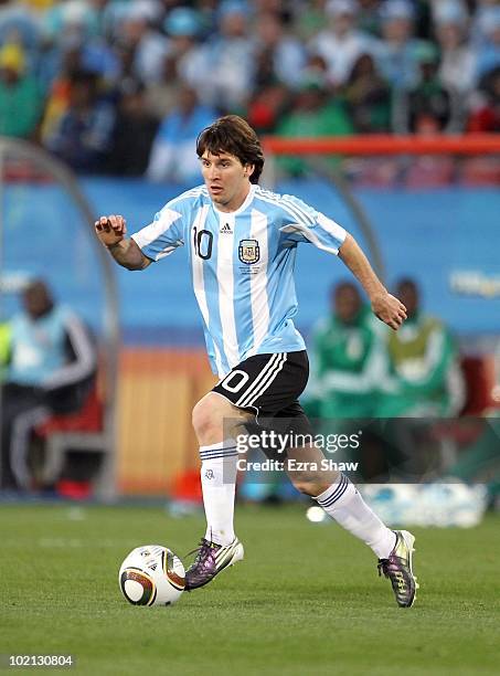 Lionel Messi of Argentina runs with the ball during the 2010 FIFA World Cup South Africa Group B match between Argentina and Nigeria at Ellis Park...