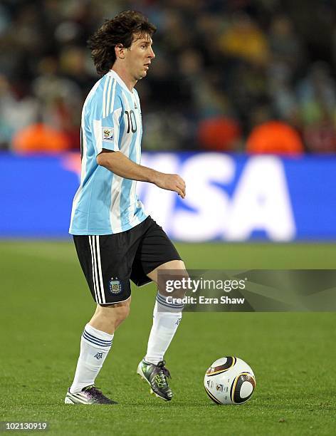 Lionel Messi of Argentina runs with the ball during the 2010 FIFA World Cup South Africa Group B match between Argentina and Nigeria at Ellis Park...