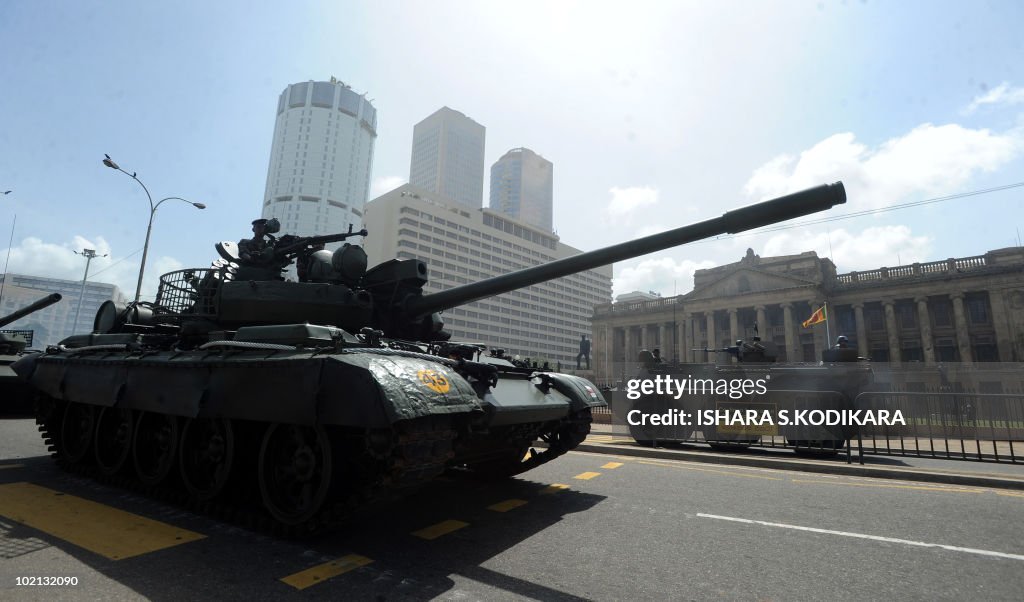 Sri Lankan army tanks roll along the sea