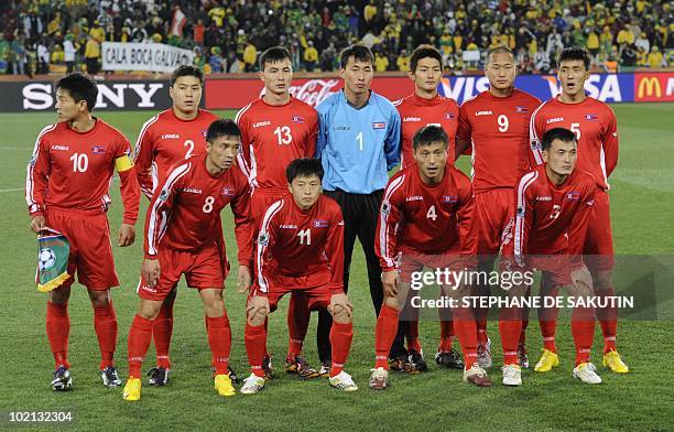 North Korea's defender Ji Yun-Nam, North Korea's midfielder Mun In-Guk, North Korea's midfielder Pak Nam-Chol and North Korea's defender Ri Jun-Il ;...