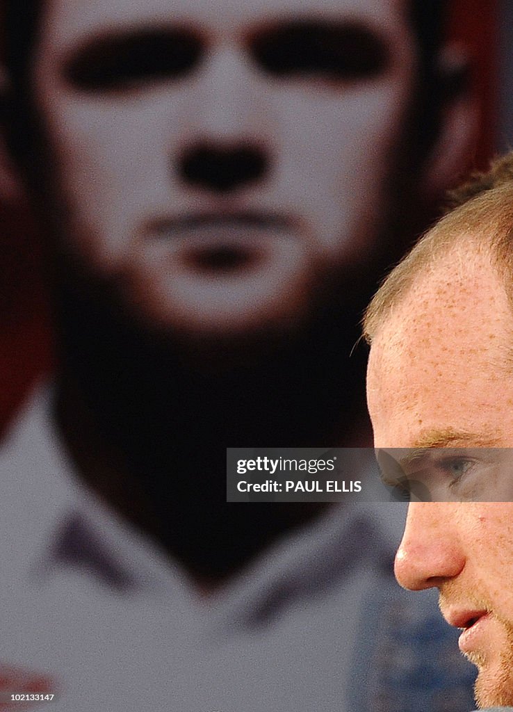 England's striker Wayne Rooney speaks du